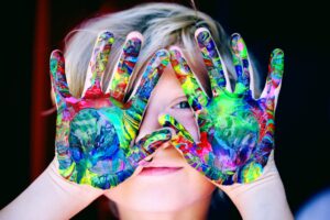 Child with finger paints